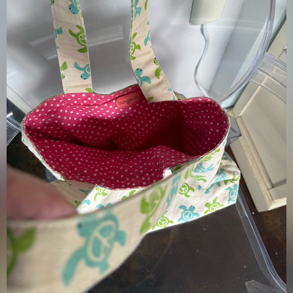 Reversible fabric tote. Hot pink on one side; blue/green turtles on the other.